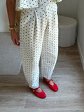 Pantalon structuré à pinces et motif pois