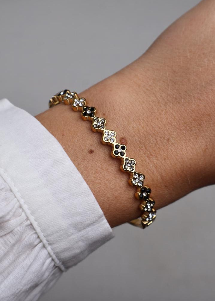 Bracelet rigide à motifs trèfles bicolores