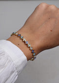 Bracelet rigide à motifs trèfles bicolores Bleu